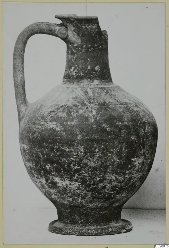 Jug with a strap handle, pinched spout and ring base, from the Bichrome-Red pottery series