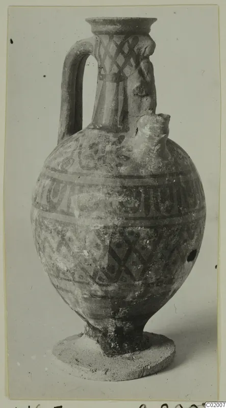 Pottery vessel White Painted VI from Vouni, with a strap handle and painted band and lattice decoration