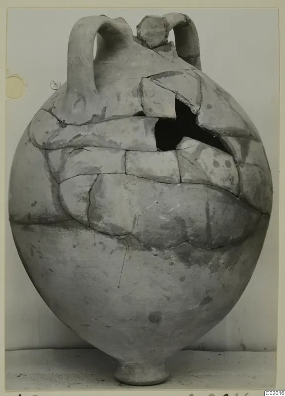 Pottery Plain White VI, a large round vessel with two loop handles, cracked and partly restored.