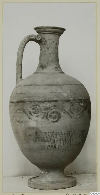 Pottery White Painted VII, a single-handled jug with painted bands and spiral motifs, from the Korakas tombs at Vouni