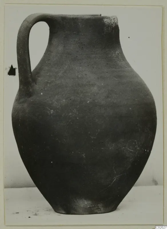 Coarse Ware jug from Vouni with a single loop handle, photographed against a plain background