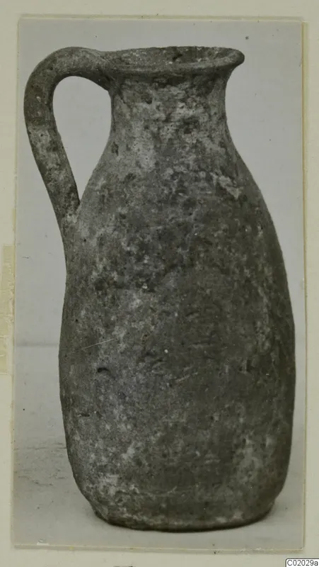Pottery Plain White VII jug with a single loop handle, from Vouni