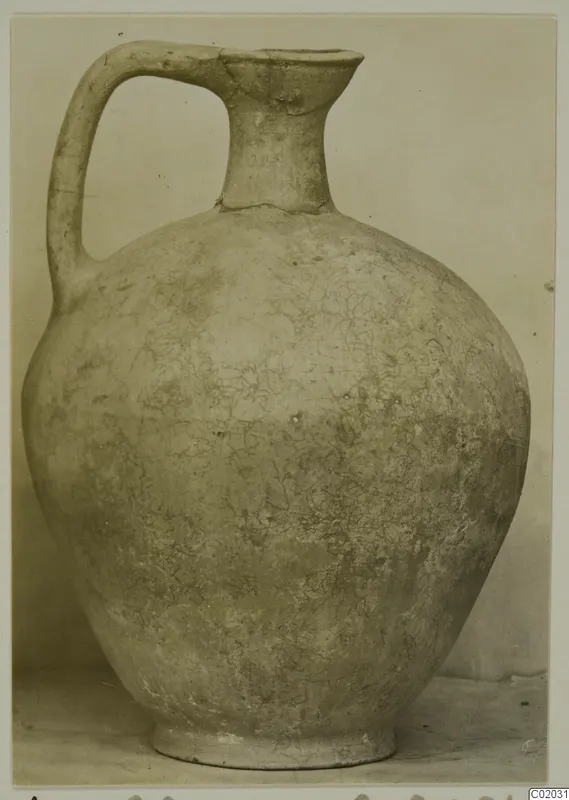 Pottery Plain White VI jug with a single strap handle and a flaring spout.