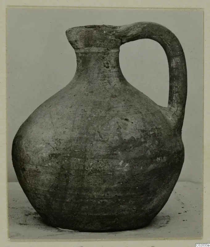Jug of Pottery Plain White VI with a single loop handle, photographed against a plain grey backdrop
