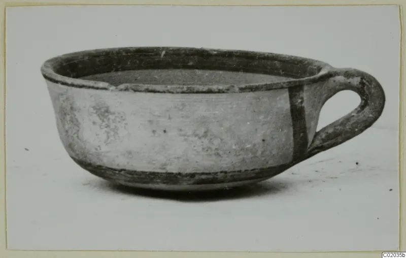 White Painted IV bowl with a loop handle, from Marion