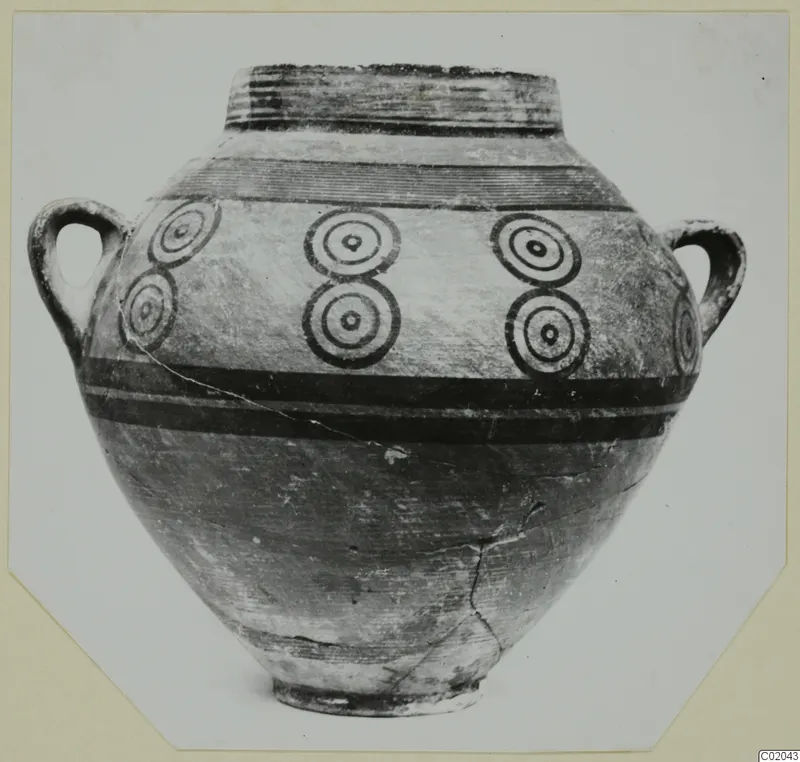 Two-handled jar from Marion with dark painted bands and rows of concentric circles