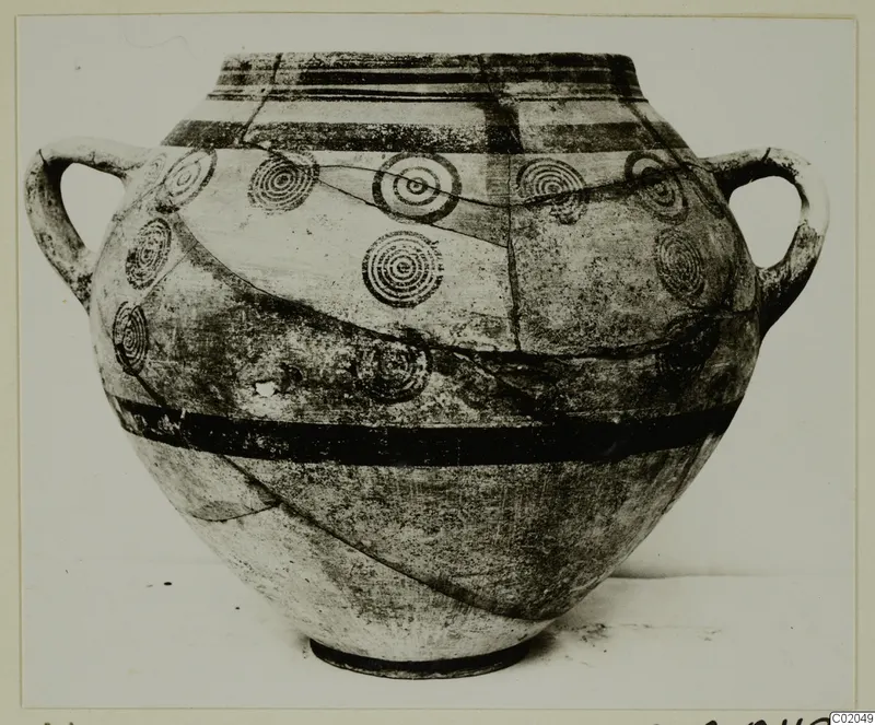 Two-handled pottery vessel with dark painted horizontal bands and concentric circle motifs, White Painted IV