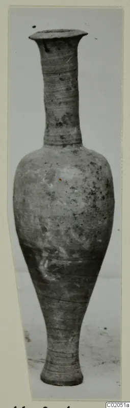 Pottery vessel with a tall narrow neck, flared rim and tapering base, from the Marion tombs