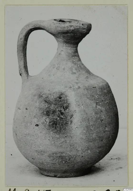 Cypro-Hell.I. jug from Marion tombs, with a strap handle and narrow neck, photographed in three-quarter view