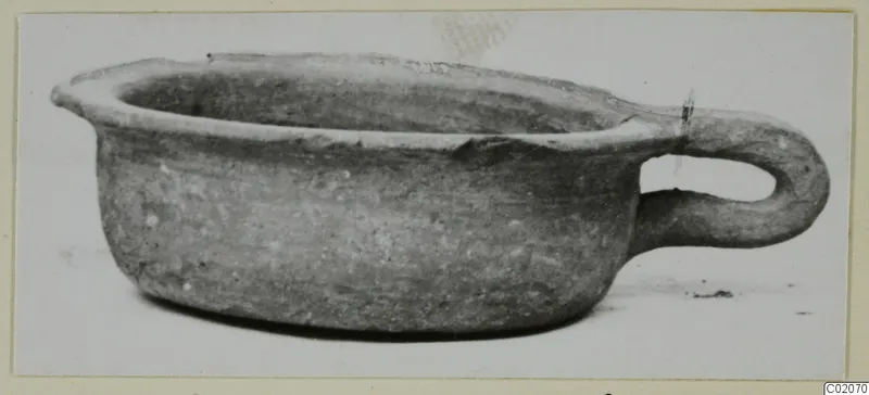 Pottery bowl with a single loop handle, from the Marion tombs, seen from the side