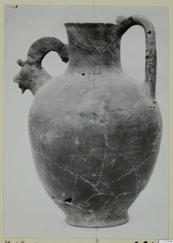 Jug with a modelled head in profile on its left handle