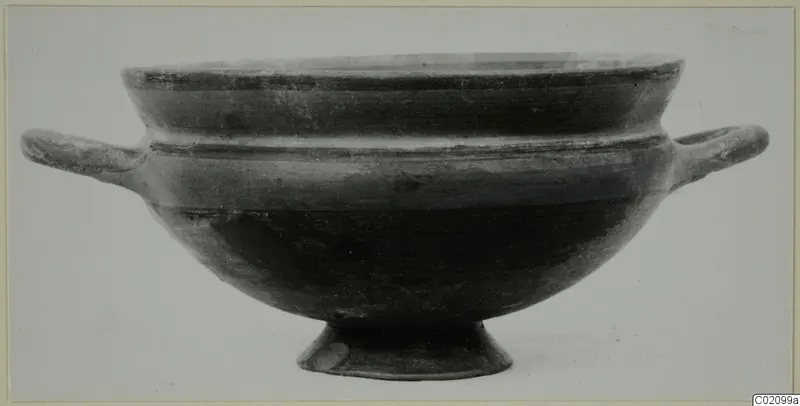Pottery bowl with two horizontal handles and a short foot, shown in side view against a plain background