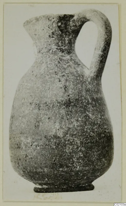 Pottery jug with a single loop handle and a narrow neck, catalogued as Black-on-Red II-IV