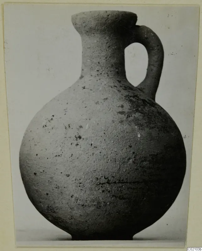 Pottery jug with a single loop handle and flared rim, from Marion