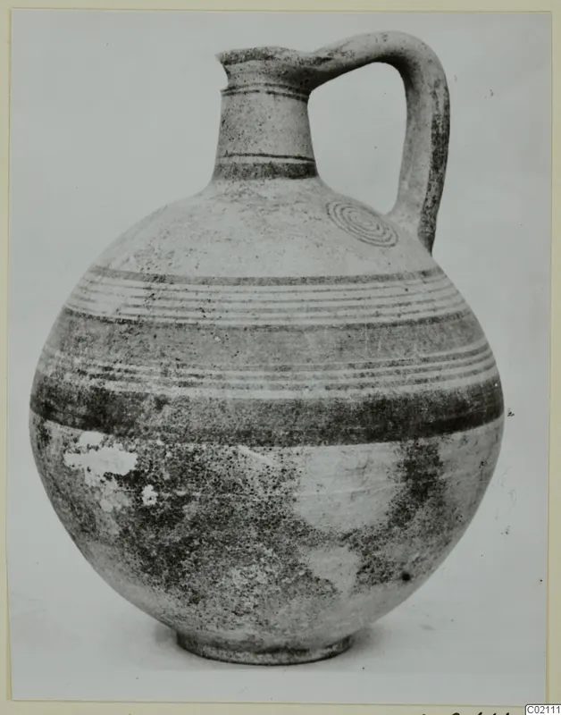 Pottery Bichrome IV jug from Marion, with a single strap handle and painted bands around the body