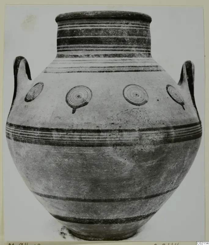 Two-handled jar with dark horizontal bands and concentric circle motifs on its body