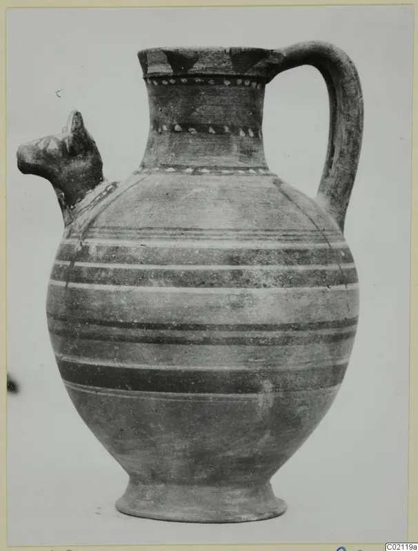 Jug with an animal-head spout, a strap handle and horizontal painted bands, from Marion