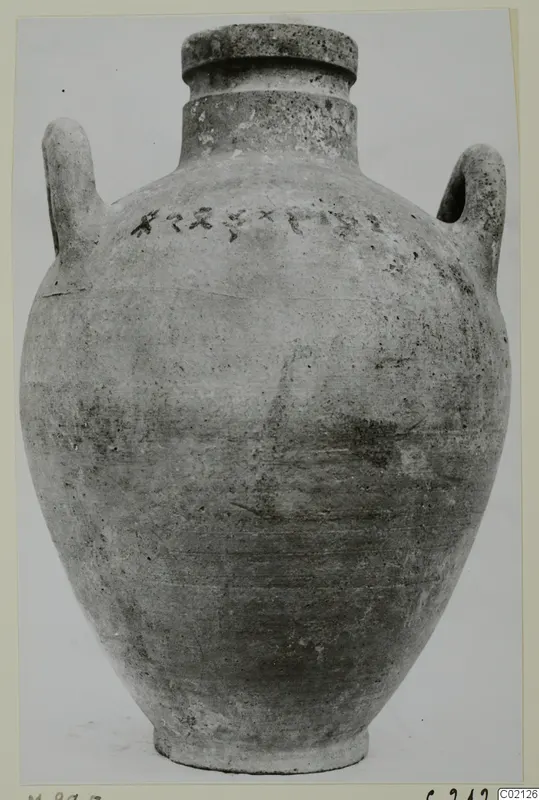Two-handled pottery amphora with a wide rim and a row of dark marks on the shoulder.