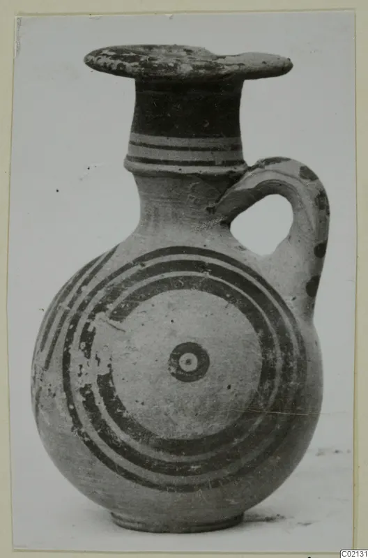 Jug with a flat rim, one loop handle and concentric painted circles on its body, from Marion