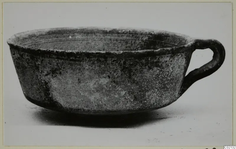 Pottery White Painted III-1 bowl with a single loop handle, side view