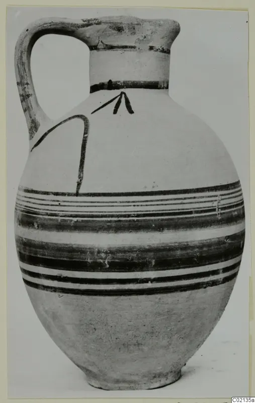 Pottery Bichrome V jug with a strap handle and dark painted bands