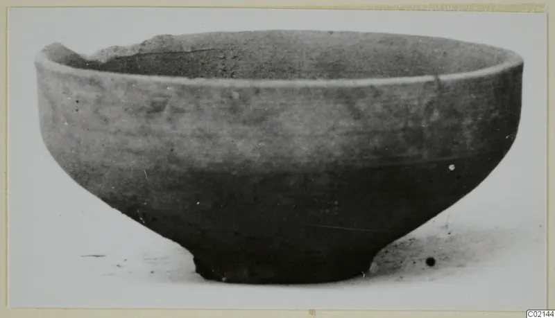 Pottery bowl from Marion, Plain White IV-V, with a broken rim at the upper left