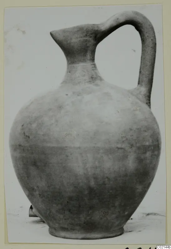 Pottery jug with a pinched spout and single loop handle, from Marion