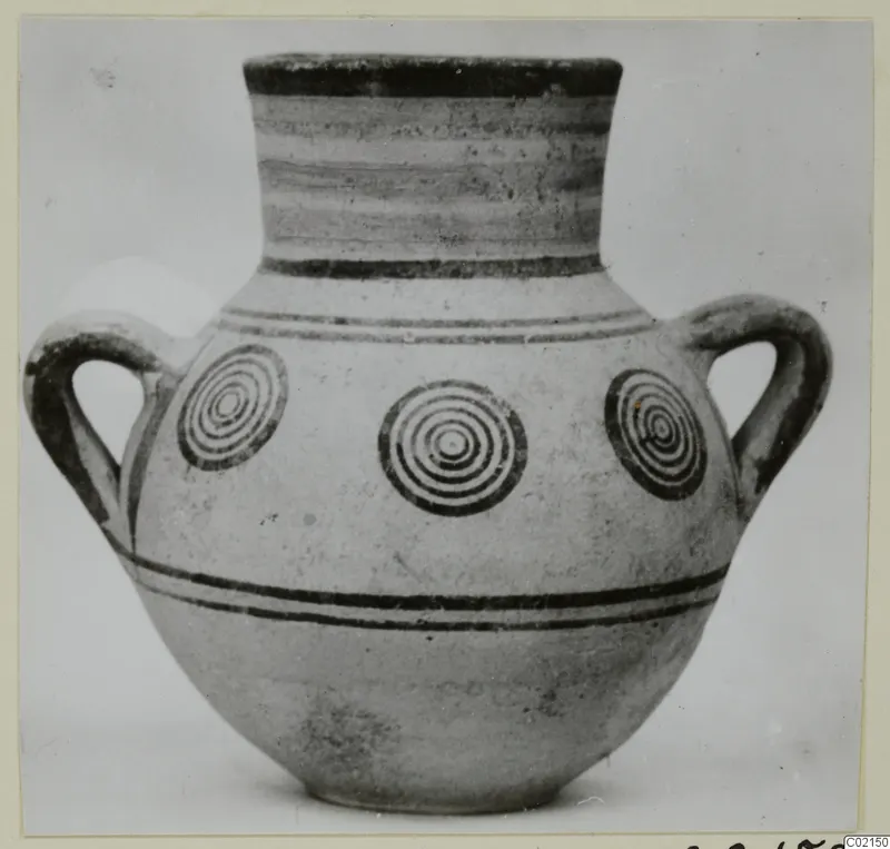 Two-handled bichrome pottery jar decorated with concentric circles and dark horizontal bands, from Marion tombs