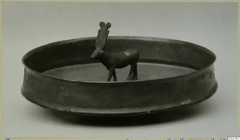 Shallow bowl from Thebes with a small standing animal figure on its floor