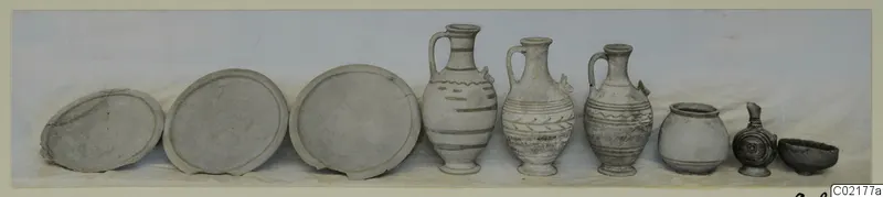 Row of nine pottery vessels from Marion, Tomb 51: three flat plates, three painted jugs and three smaller vessels.