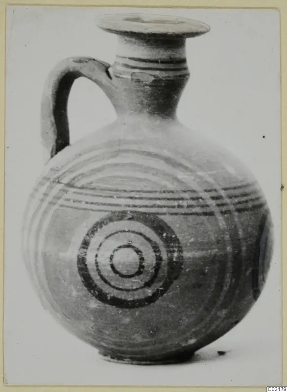 Jug from Marion with a single loop handle, painted concentric circles and horizontal bands on the body