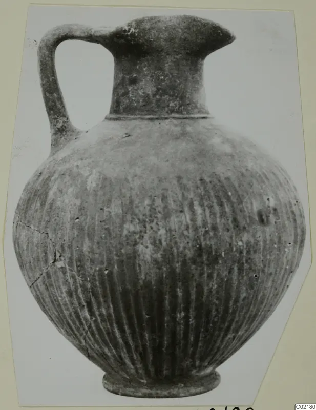 Black Slip jug from Marion with vertical grooves on the body and a single strap handle