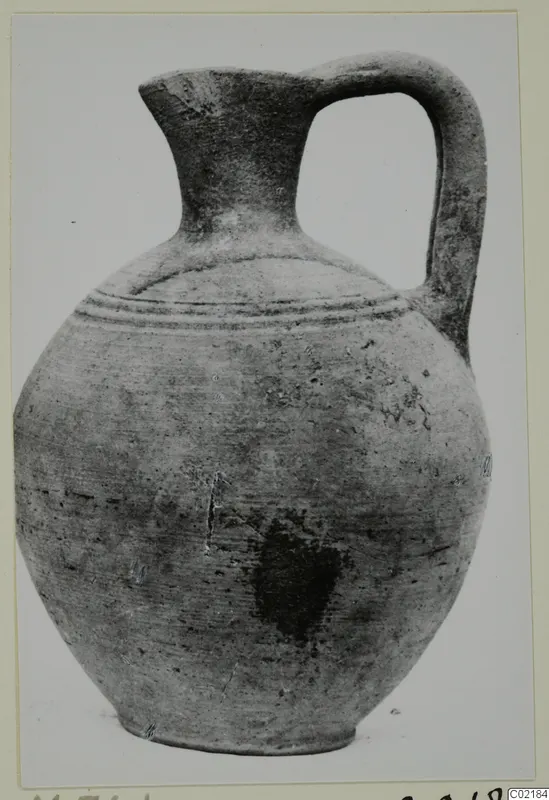 Plain White I-III jug with a single strap handle and narrow neck, photographed against a pale background