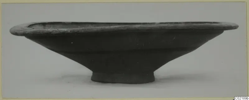 Pottery Black-on-Red II-IV bowl from Marion, side view, with a wide flaring rim and small ring foot