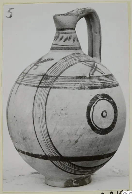 Pottery vessel, White Painted V: a globular jug with a strap handle and dark painted bands and concentric circles