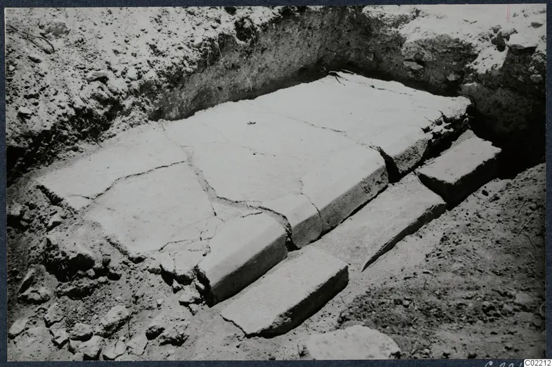 Large stone slabs and steps exposed in an excavation trench at Vouni Palace