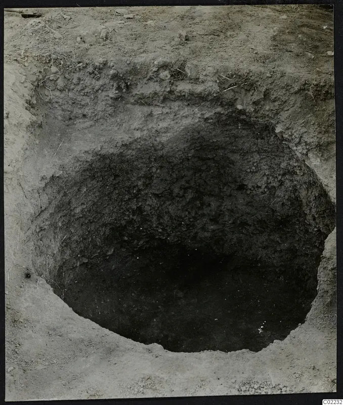 Excavation pit at Ayios Iakovos with loose stones on the surrounding ground