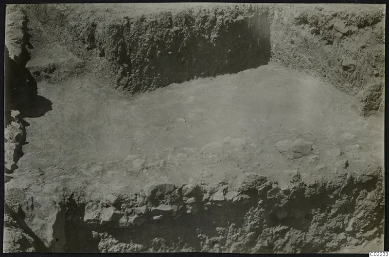 Excavation trench at Ayios Iakovos with exposed stones in the floor of the cutting
