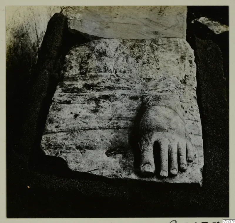 Stone statue fragment of a bare foot with toes, on a block of stone at Kition.