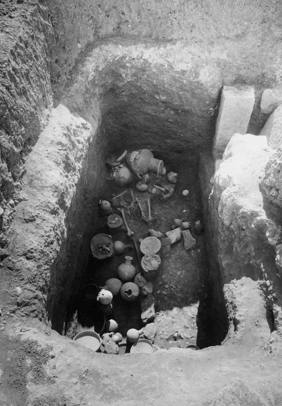 Tomb 23 at Amathus, floor stratum in situ, with pottery vessels and skeletal bones in an excavated pit