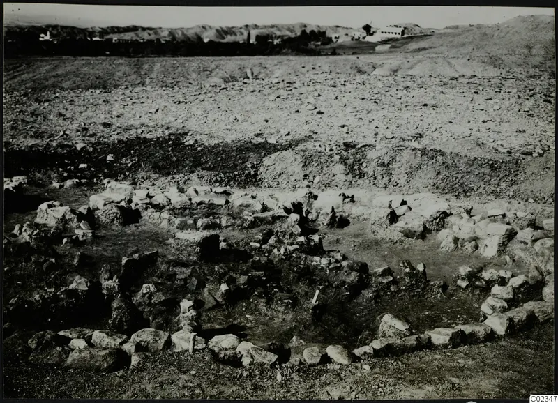 Excavation at Kythrea showing a stone construction, low rough stone walls set in the ground