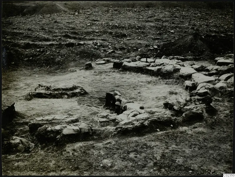 Excavated stone construction at Kythrea, with low stone walls enclosing a pale cleared surface