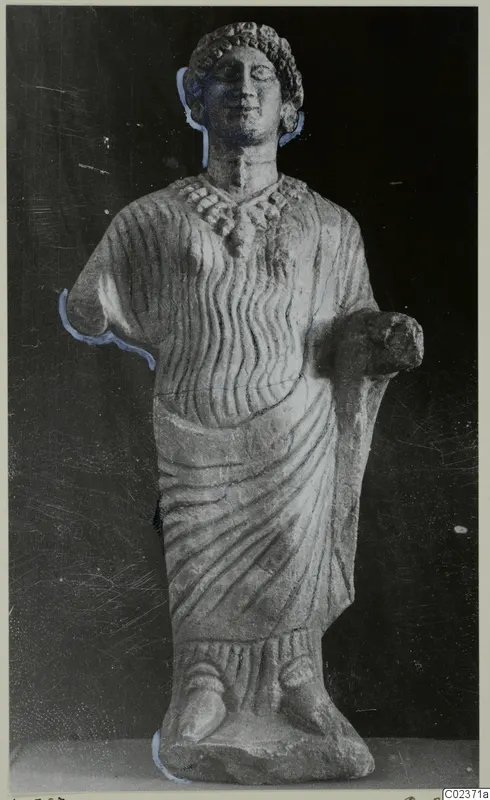 Limestone statue of a standing draped figure with curled hair and a necklace, from Vouni
