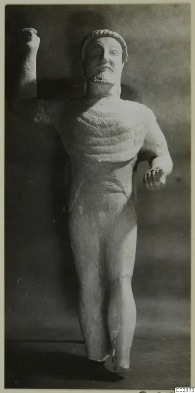 Limestone statue of a bearded standing male figure from Kition, one arm raised
