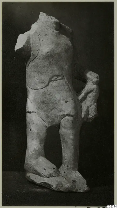 Limestone statue fragment of a standing figure, headless, legs and feet on a rough base, from Kition.
