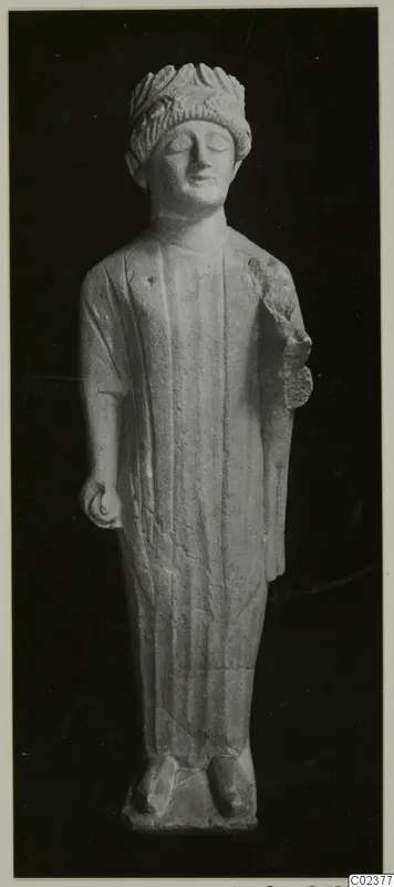 Limestone statue of a standing figure with closed eyes and a head covering, Limestone Cypro-Greek II