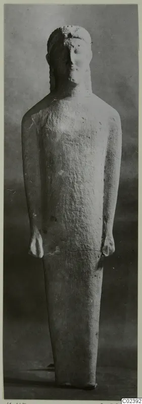 Limestone statue of a standing figure with arms at its sides, from Kition