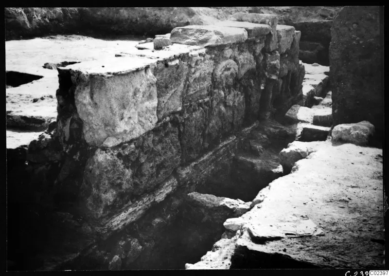 Excavated stone substructure of the temple at Kition, with large blocks forming a wall face to the north