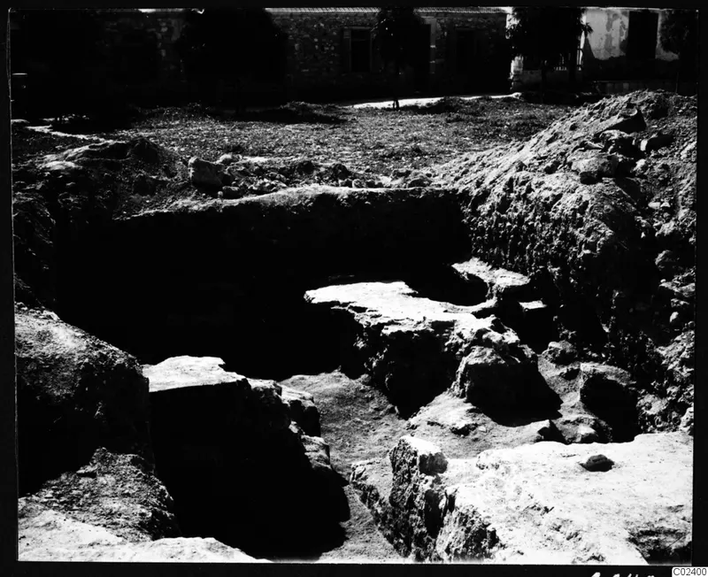Excavation at Kition showing the western end of a temple substructure of large stone blocks in a trench