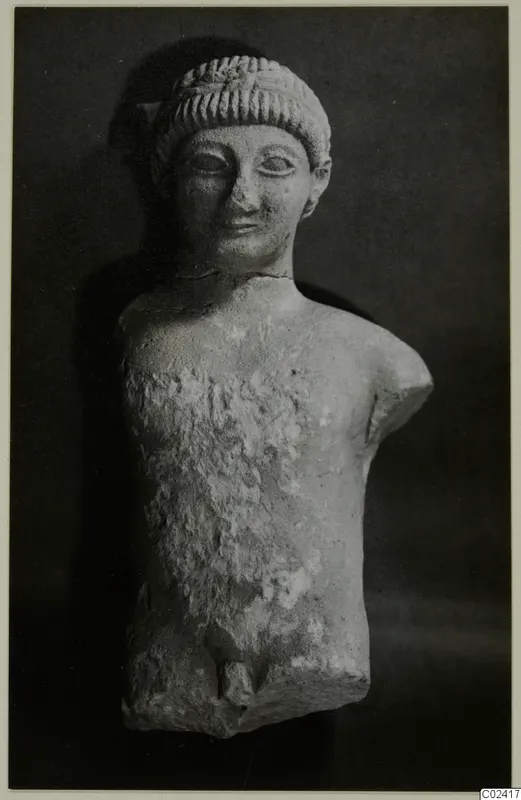 Limestone statue of a male figure from Kition, head and torso only, with the arms broken off